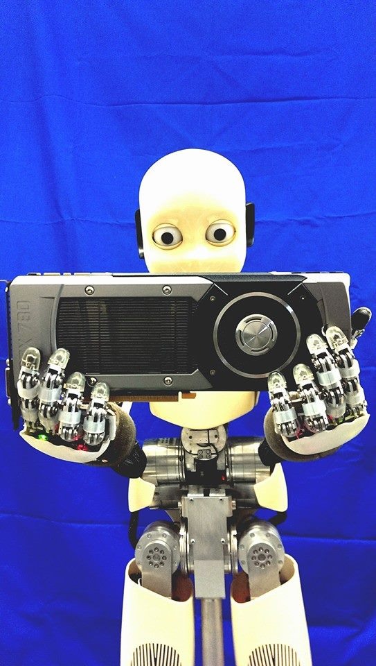 The iCub humanoid robot holding an NVIDIA GPU