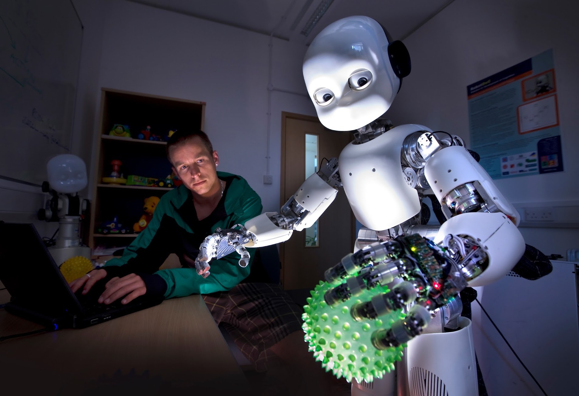 Martin Peniak with the iCub humanoid robot during PhD research.