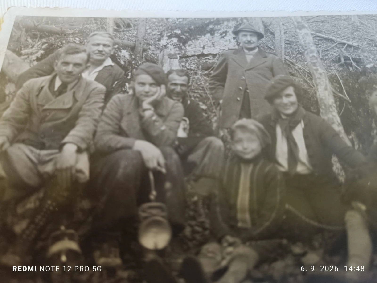 A family group photograph. Pavol Bučan is the man standing at the back on the right, wearing a hat and dark coat.